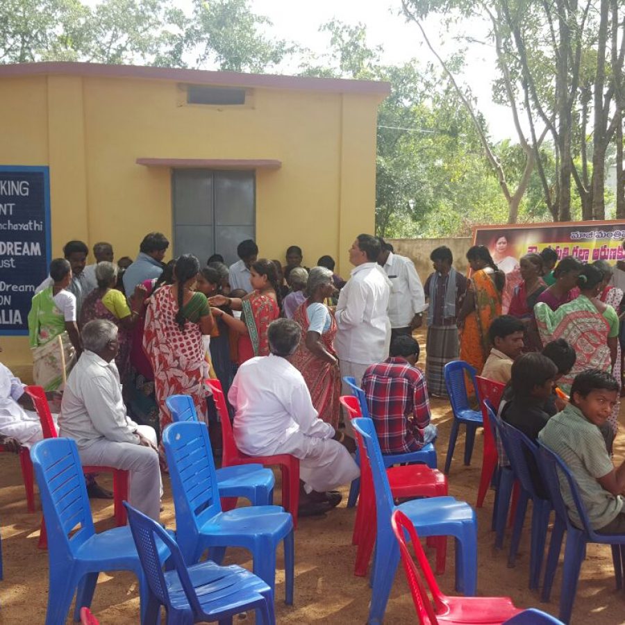 The villagers waiting for the opening ceremony